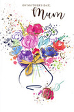 The image on this Mother's Day card features a lively watercolour bouquet that feels at once modern and timeless, much like the character of East Sheen itself. At its heart, bold cerise and fuchsia blooms open generously, their petals suggested by sweeping brushstrokes and accented with inky indigo lines that offer structure amid the softness. Softly blended touches of lilac, dusky blue, apricot, and pale peach peek from between the main flowers, giving the sense of a mixed spring bouquet, the kind you might see carried home along Upper Richmond Road after a visit to a local florist. Subtle metallic gold accents trace parts of the petals and leaves and appear as tiny dots scattered through the composition, catching the light in the mind's eye like sunshine glinting on dew-covered petals in a garden near Richmond Park. Around the central bouquet, playful splatters of paint and delicate heart shapes float across a crisp white background, adding to the sense of joy, celebration, and affectionate chaos that often surrounds family life. The arrangement sits in a simply drawn vase, its curved shape washed in pale, transparent tones that suggest either glass or ceramic, cinched with a neat golden bow that looks lovingly tied. The whole artwork feels like a heartfelt sketch refined into a keepsake, capturing the emotion of gifting flowers to a beloved mum in East Sheen. It conveys warmth, appreciation, and a quiet sense of home, echoing the comfort of fresh Mother's Day blooms thoughtfully arranged and delivered to local doorsteps.